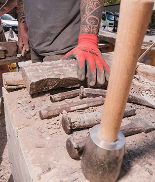 Stone Mason with tools of his trade
Stone hammers