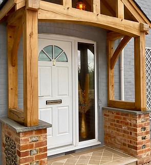 Brick wing walls with flintstone panels for a front porch