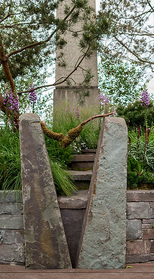 Squeeze stile. Stone split to create squeeze stile at Monument garden Chelsea Flower Show designed by Max Parker-Smith