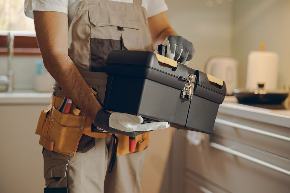 close-up-professional-handyman-standing-home-kitchen-holding-his-tool-bag.jpg