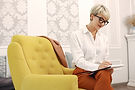 psychologist-with-glasses-sitting-chair-office (1).jpg
