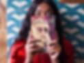 surprised-woman-holding-a-book-mockup-while-against-a-tiles-wall-a17345.png