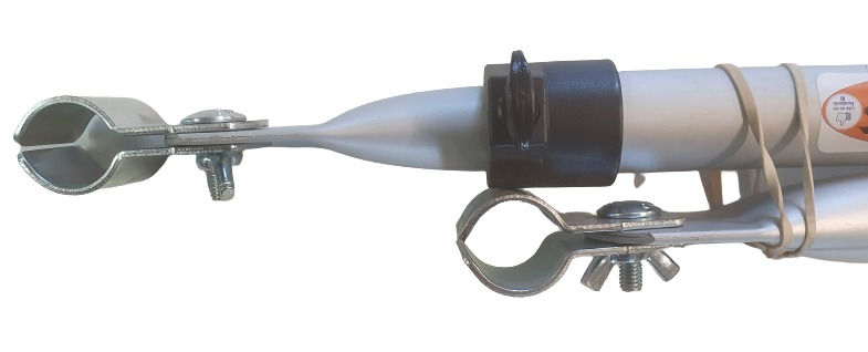 Close-up of a long, silver object with clamp on white background.