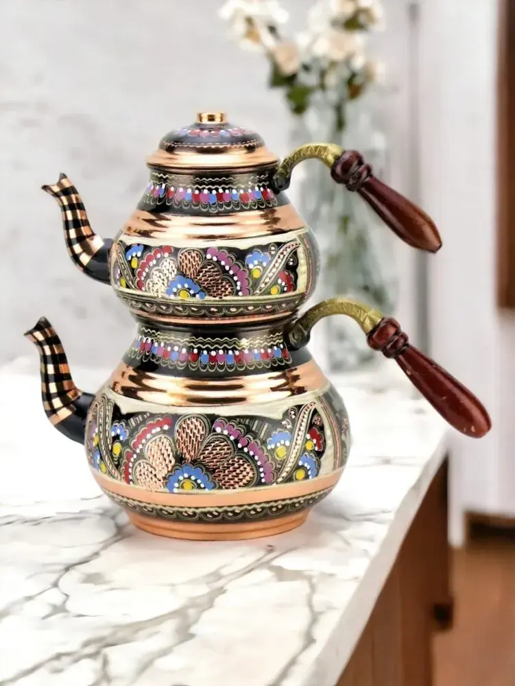 Handmade copper Turkish tea pot with wooden handle.