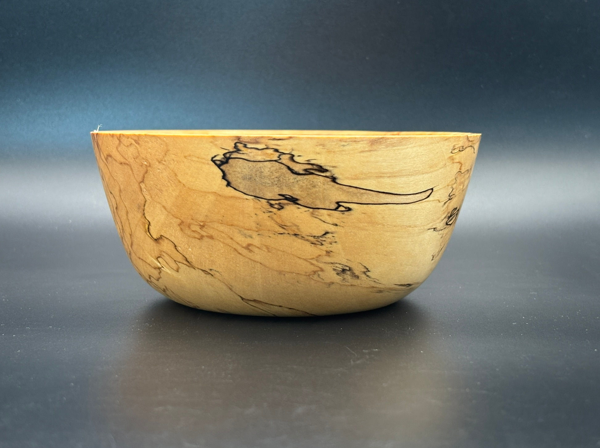 Check out the cool charm of this Spalted Maple Bowl, a one-of-a-kind piece.