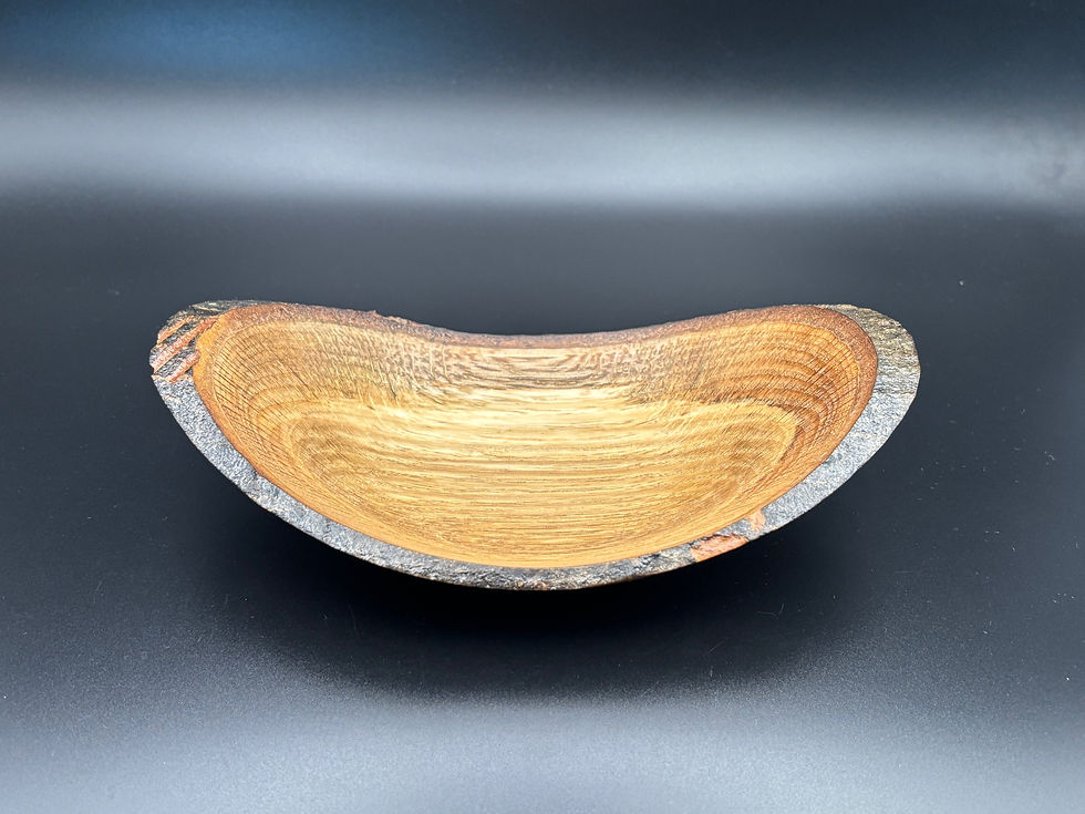 Rustic charm meets refined craftsmanship in this shallow Red Oak bowl.