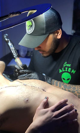Green Alien Tattoo tattooing