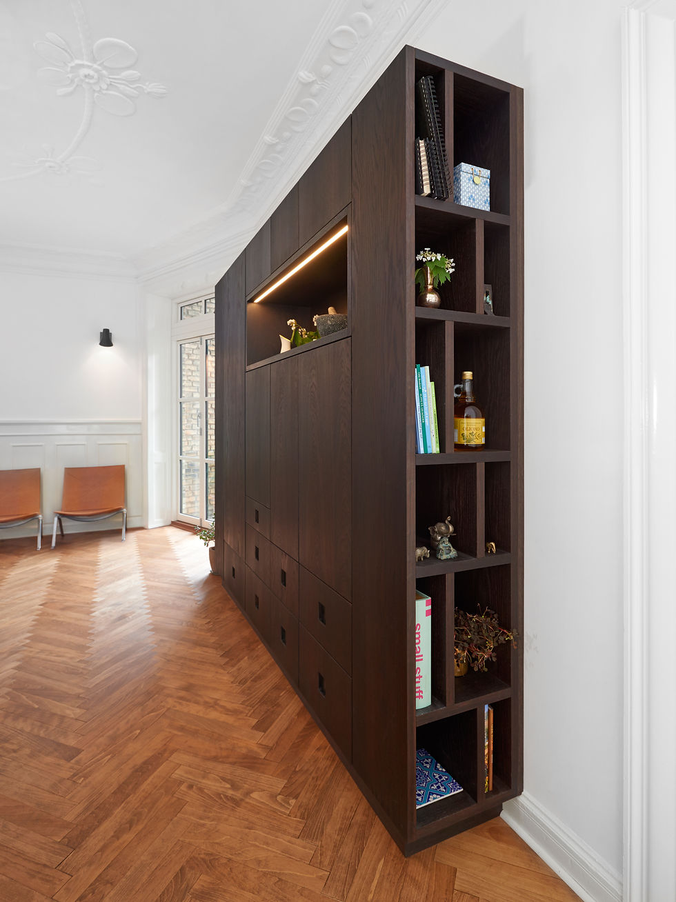 Luxurious storage solutions in dark oak