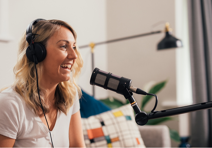 Picture of girl with headphones podcasting using the Sontronics Podcast Pro Black microphone in living room setting