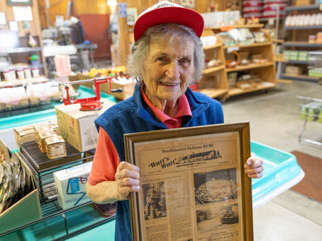 Hilda Beiersdorfer Orchard holding REMC History