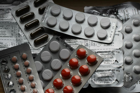 A picture of various pill packets, presumed to be birth control.