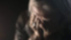 Woman with head in hands
