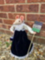 Suffragette with "Votes for Women" placard