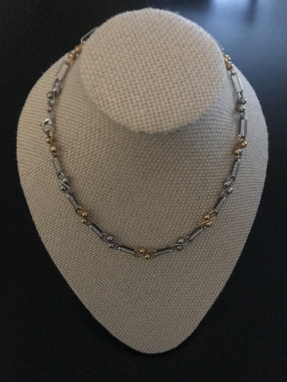 Beautiful necklace with a variety of Metal pieces in two colors