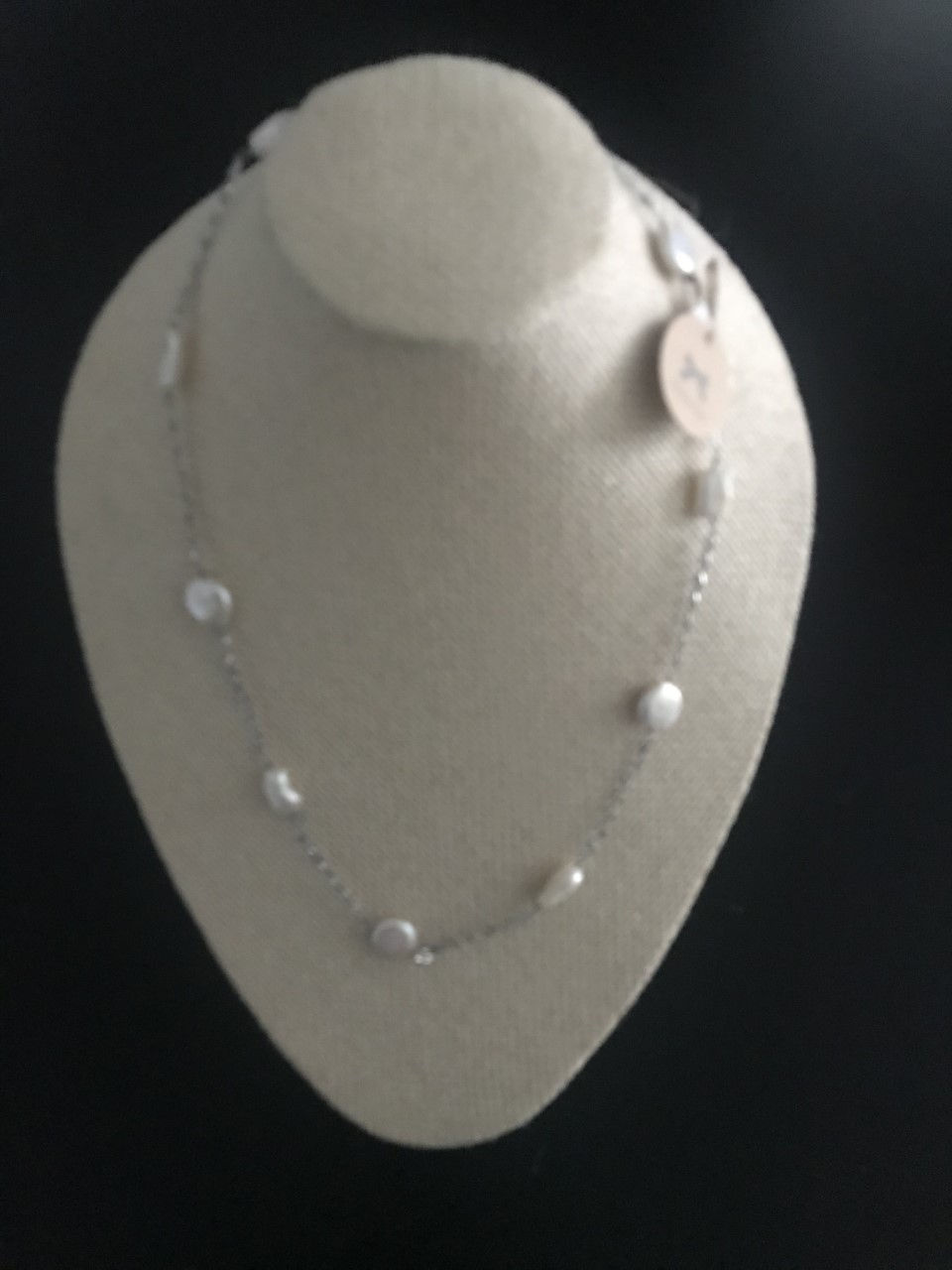 Delicate design in one strand with pieces of Mother Pearl