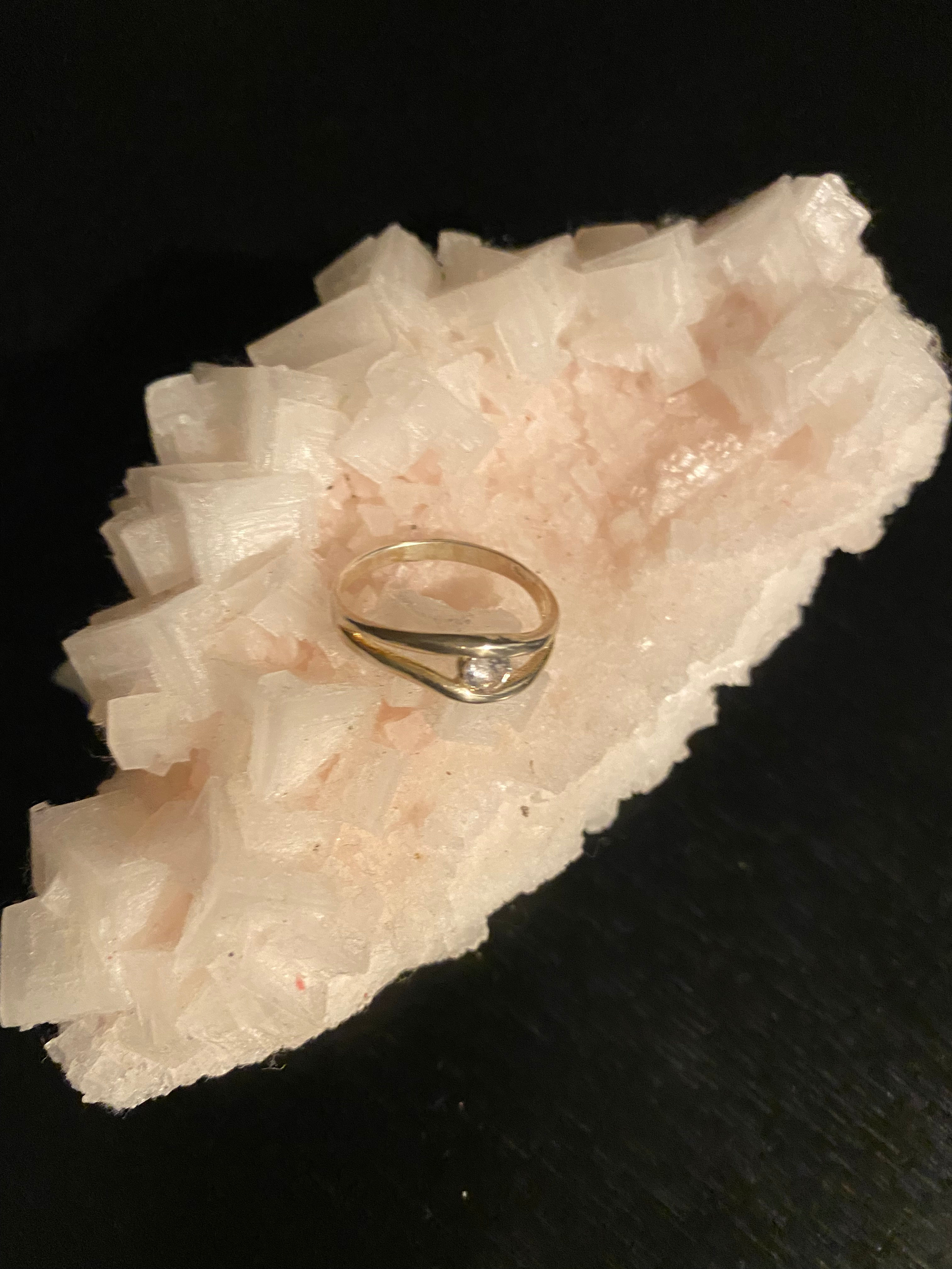 Silver Ring with a Zirconia in the center.