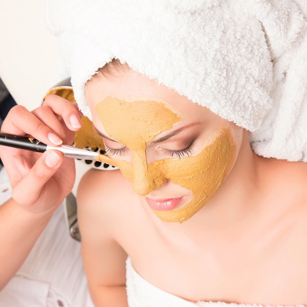 Woman getting a Crystal Hydra Gold Facial