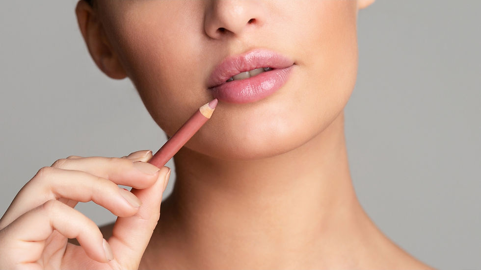 Person applying lip liner to define lips