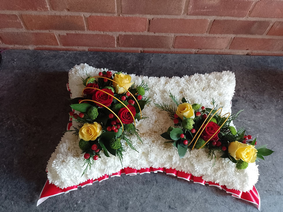based pillow in white, yellow, red and green