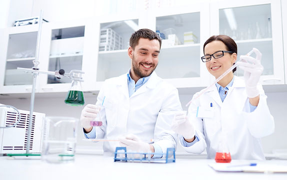 science-chemistry-technology-biology-people-concept-young-scientists-with-pipette-glass-ma