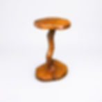 Handcrafted oak side table with a natural curved branch pedestal, polished live-edge slab top, and dark resin inlay accents.