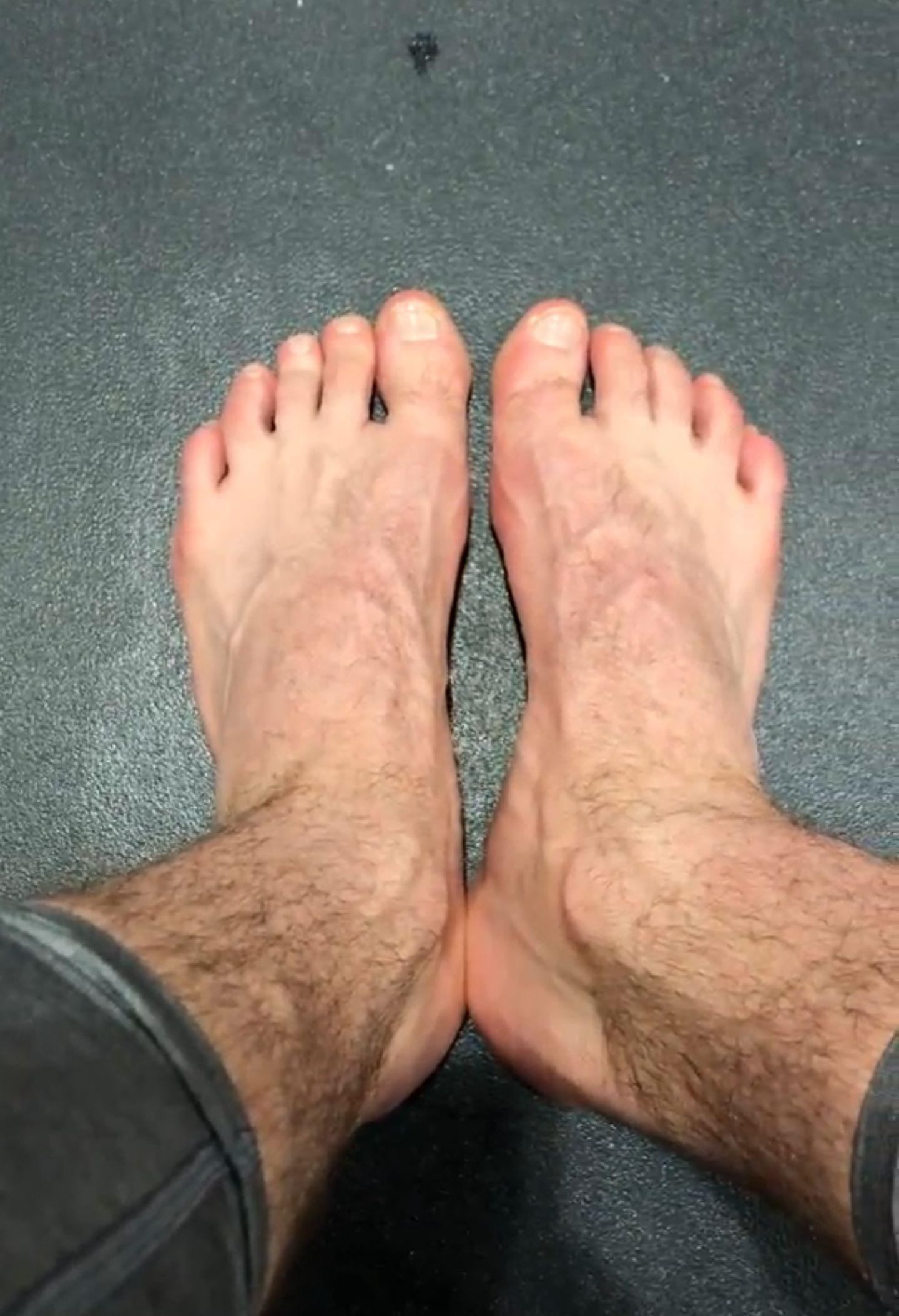 Tony shows his sweaty socks and size 15 US feet after basketball practice