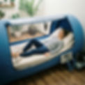 AI image of a woman smiling as she lies in an oxygen therapy chamber