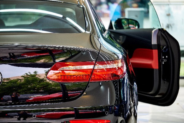 rear view of a black car with the door open