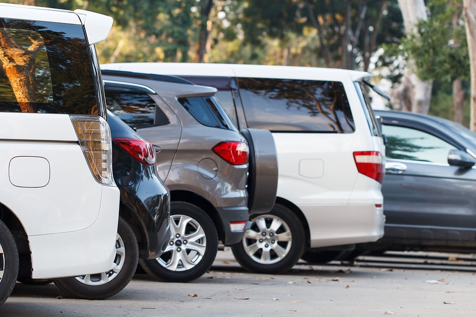 row of cars at a dealership