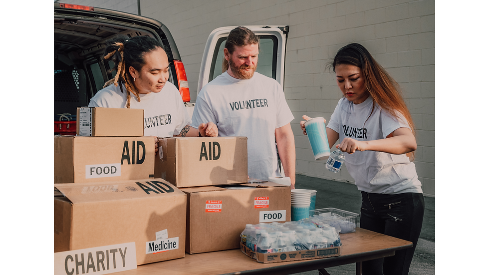 People volunteering, giving charity, providing donations such as aid, food and medication to those in need
