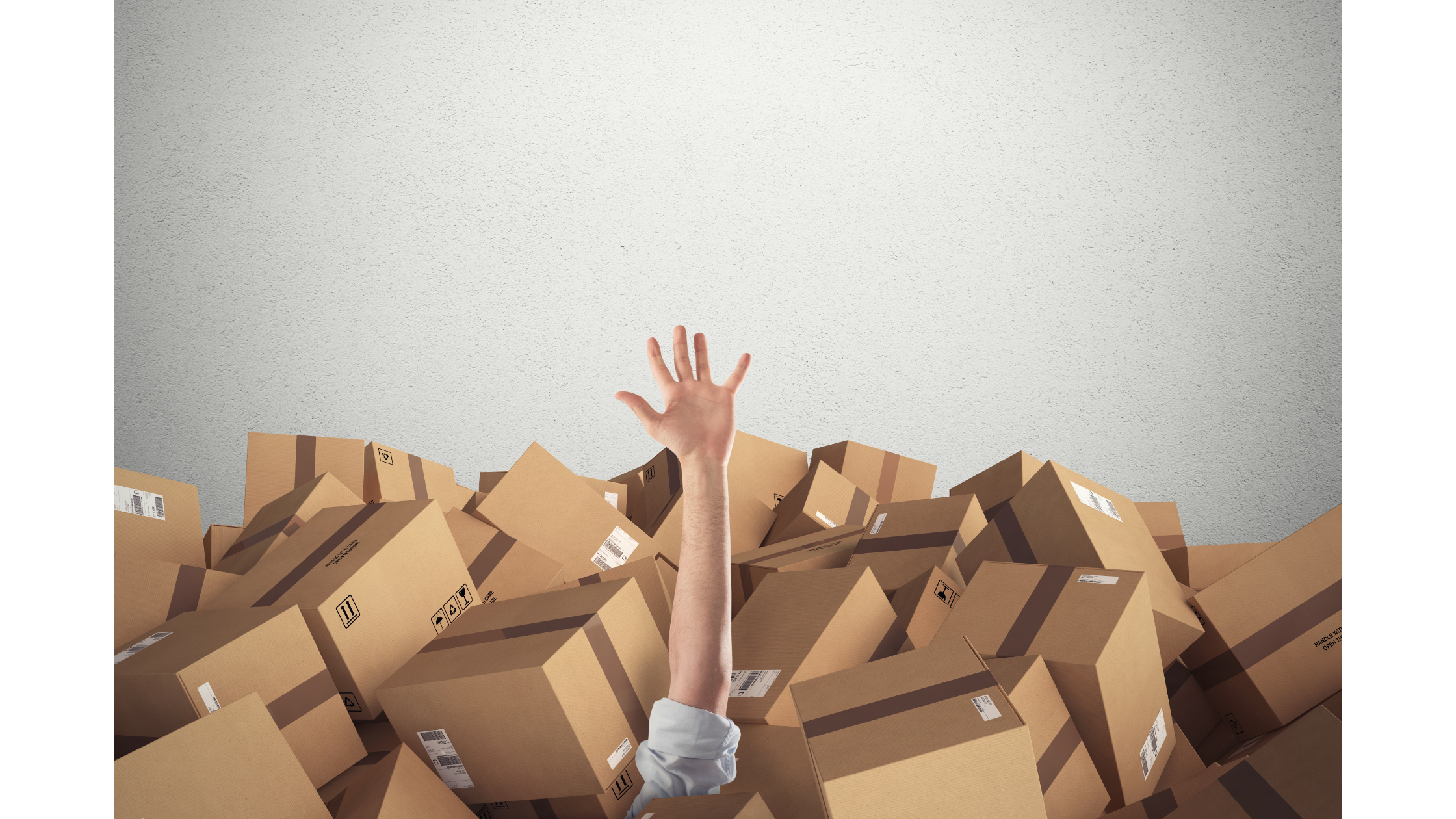 A person's hand sticking out of a sea of storage containers