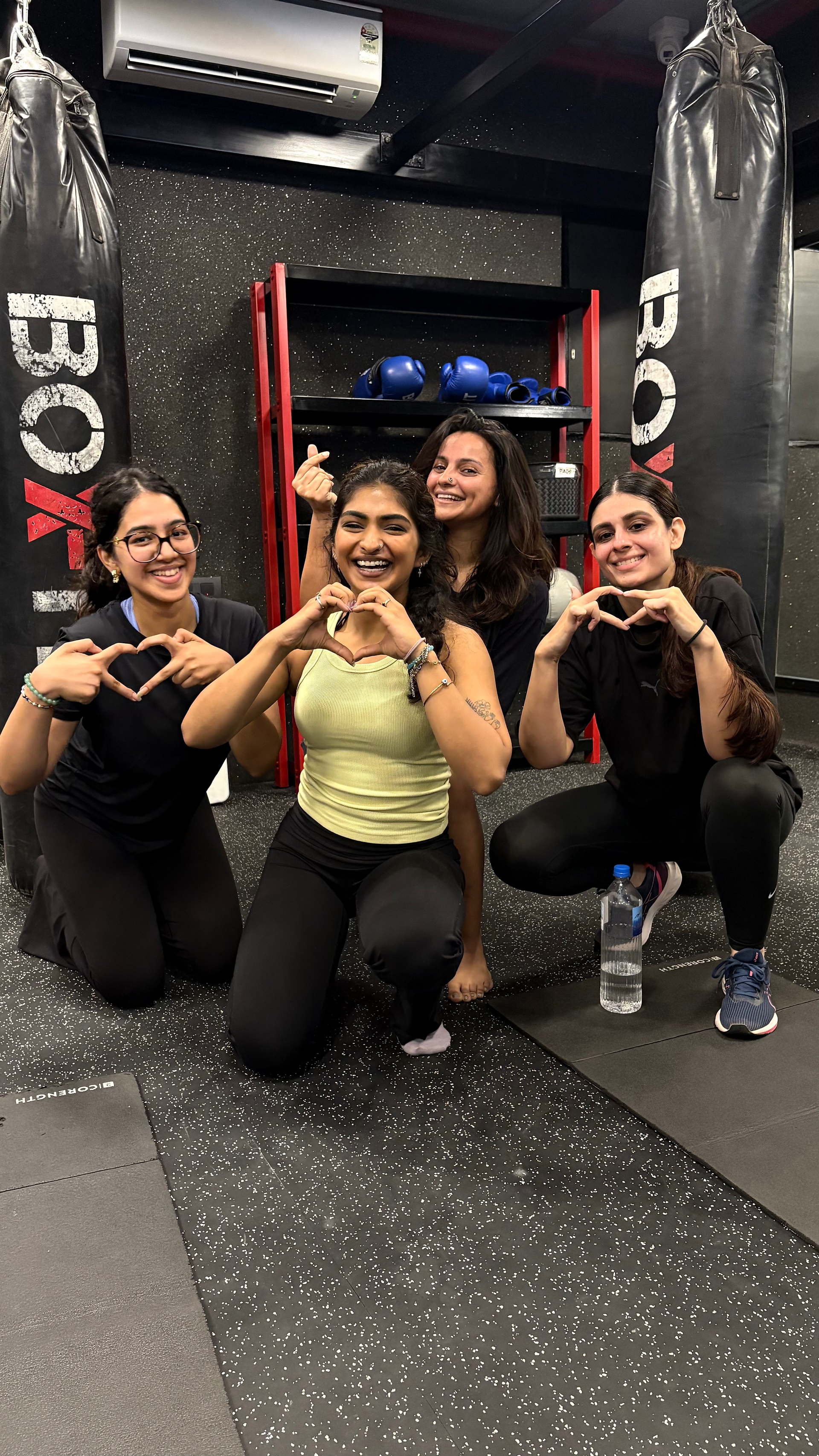 Group photo of BoxFit Studios members and coaches post-workout