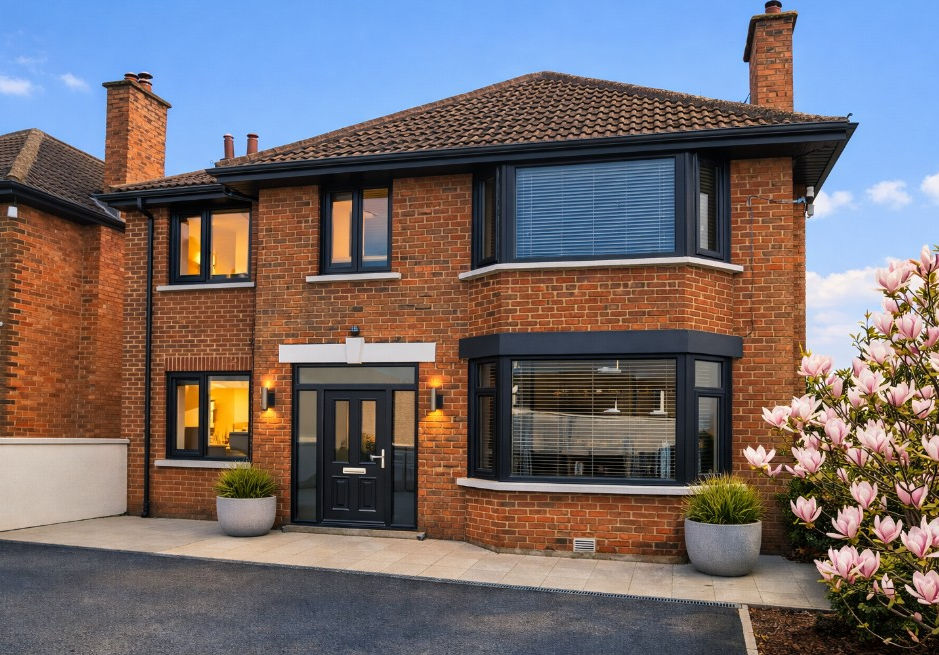 Completed two‑storey side extension and refurbished front elevation in Gilnahirk, Belfast, designed by GT Building Design.