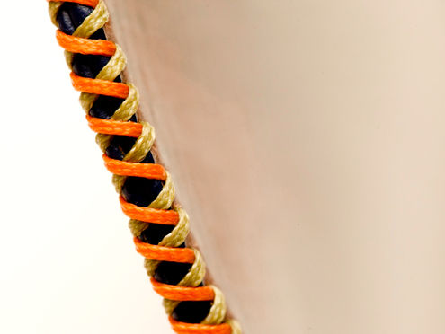 hand-cross-stitched with durable UV-resistant German waxed threads.