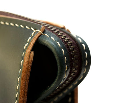 Saddle-stitched Horween shell cordovan clutch