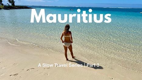 Woman standing on a tropical beach in Mauritius with turquoise water