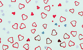 small-paper-hearts-scattered-table.jpg