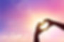 Close up love shape of hand at sunset sk