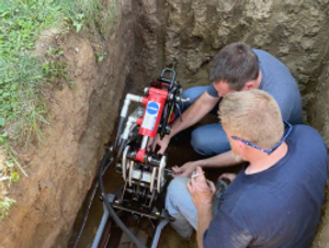 Lincoln & plumbing Sewer Laying team performing a trench-less Sewer repair