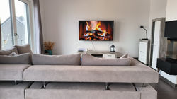 couch with 65'' SmartTV