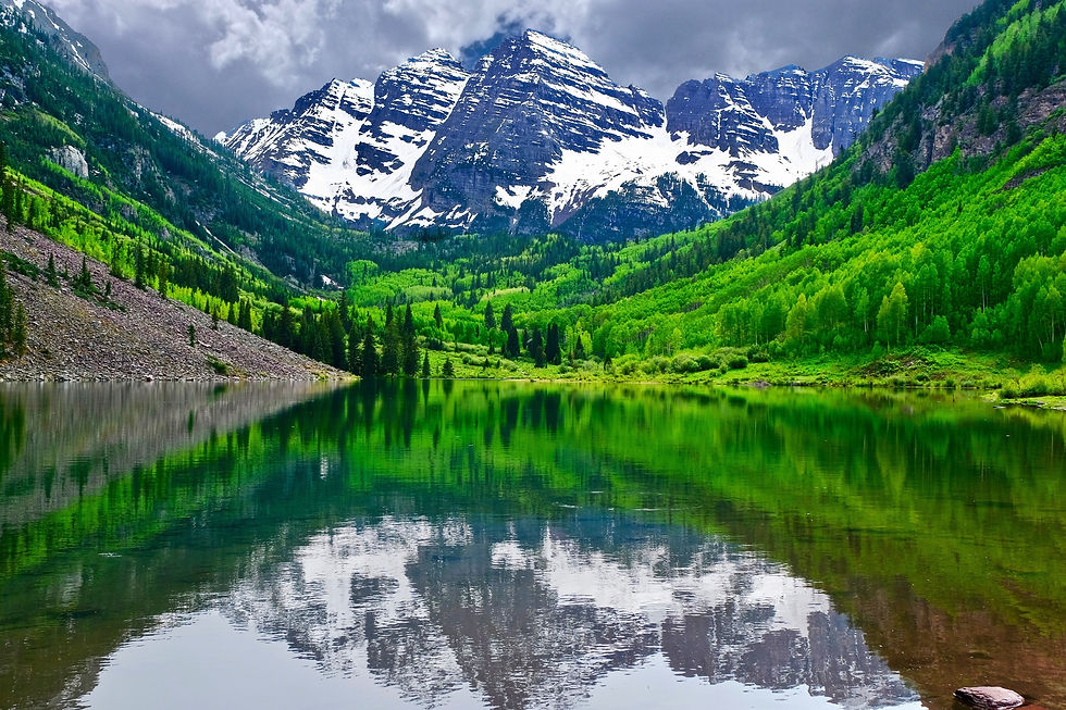 Mountain peak reflection in calm lake. Maroon Bells near Aspen, Snowmass Village, Colorad