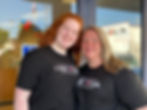 Ellie and Dixie Behn standing side by side in front of VOAWW office