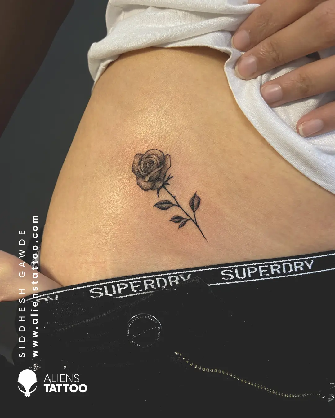 small rose tattoo