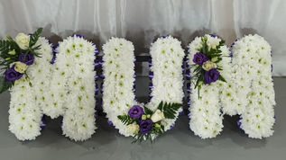 Floral name bouquet sign spelling MUM : White Based with Purple & White Flowers