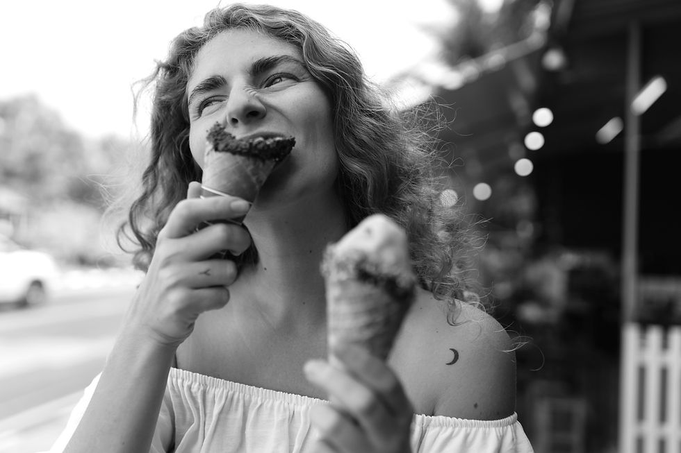 young-woman-eating-ice-cream-cone_edited.jpg