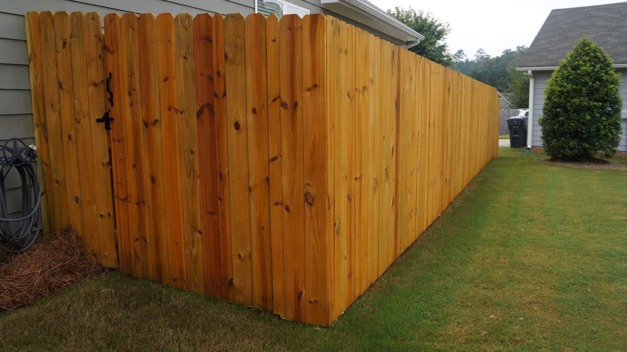 Light Honey stained wood privacy fence in Canton Georgia