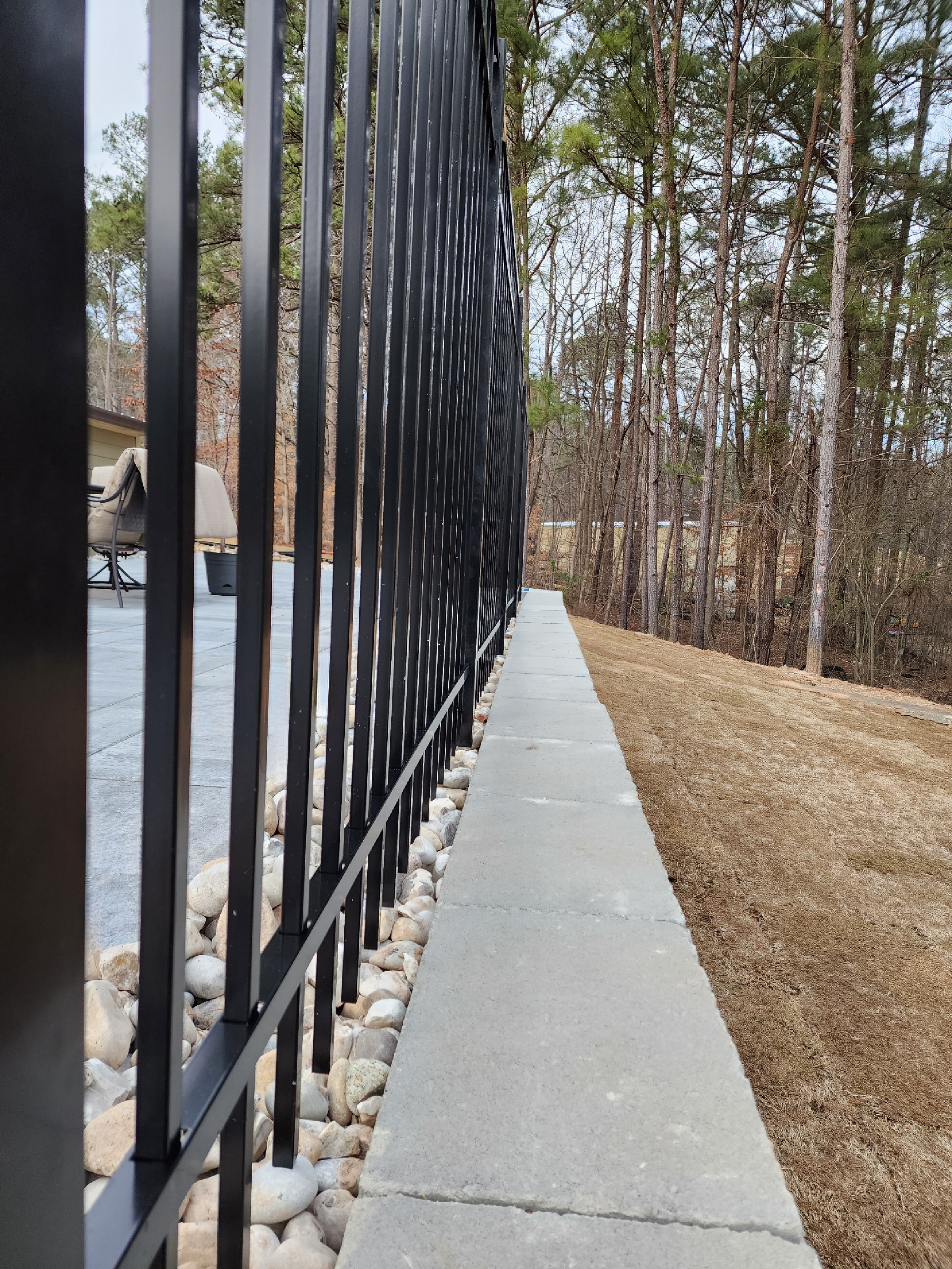 No dig aluminum pool fence at retaining wall in Gainesville Georgia