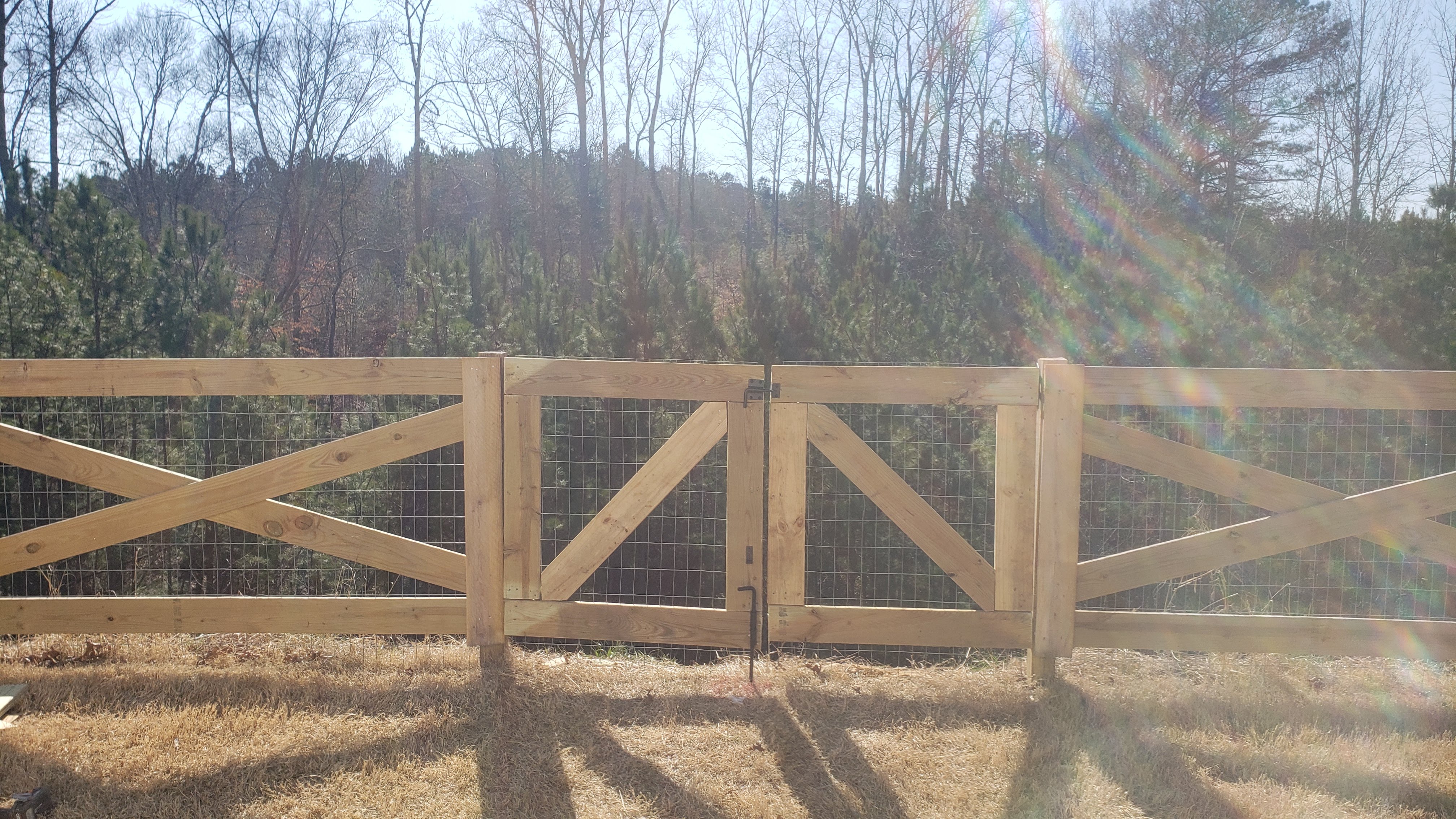Cross buck wood fence with wire in Acworth Georgia