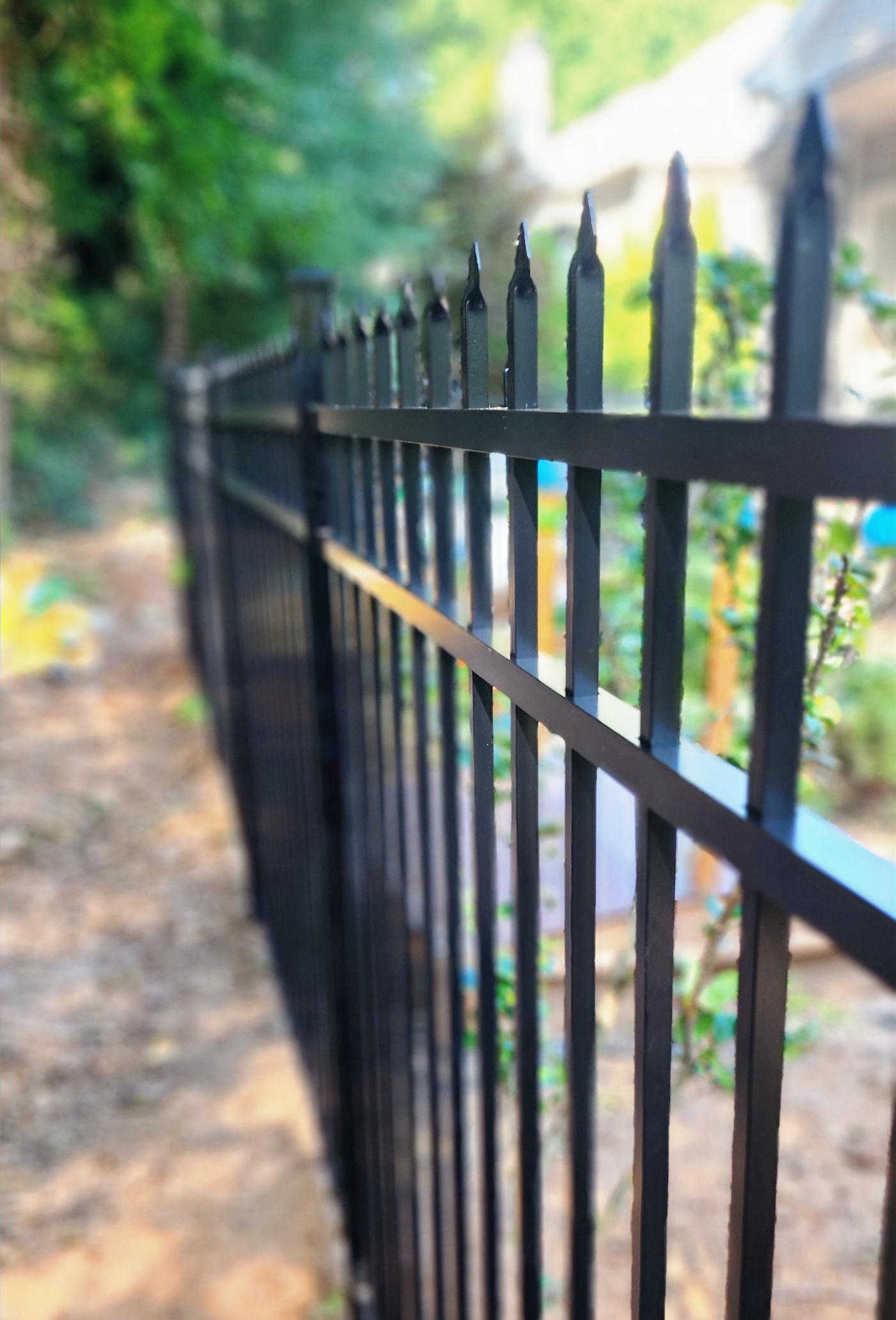 Black three rail spear top aluminum fence in Woodstock Georgia
