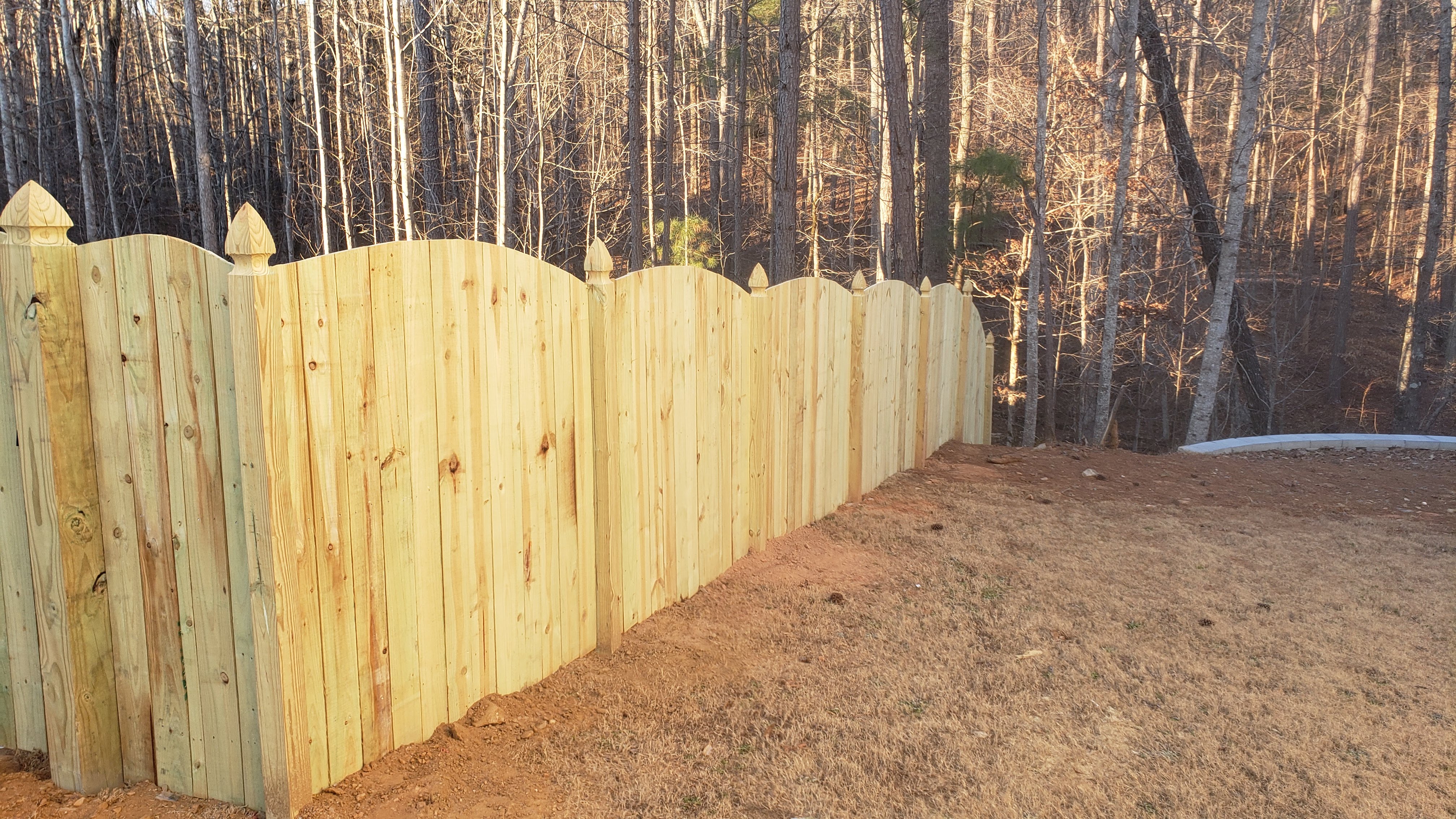 Sunrise wood privacy fence with French Gothic posts in Canton Georgia